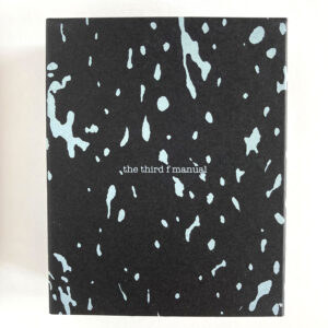 the speckled white on black box that holds the third f manual.