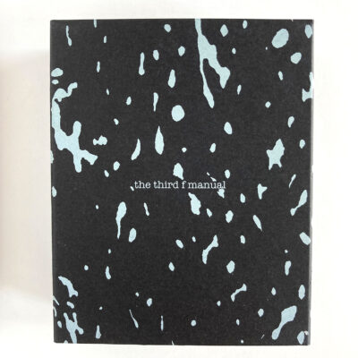 the speckled white on black box that holds the third f manual.
